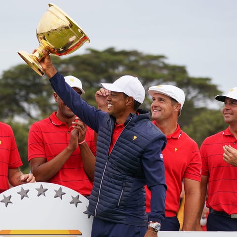 Tiger Woods and Team USA celebrate after winning t