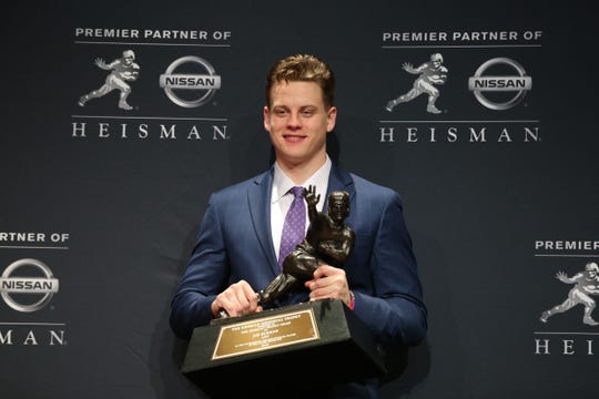 Dec. 14, 2019: LSU Tigers quarterback and Heisman Trophy winner Joe Burrow poses with the trophy during a post ceremony press conference at the New York Marriott Marquis.