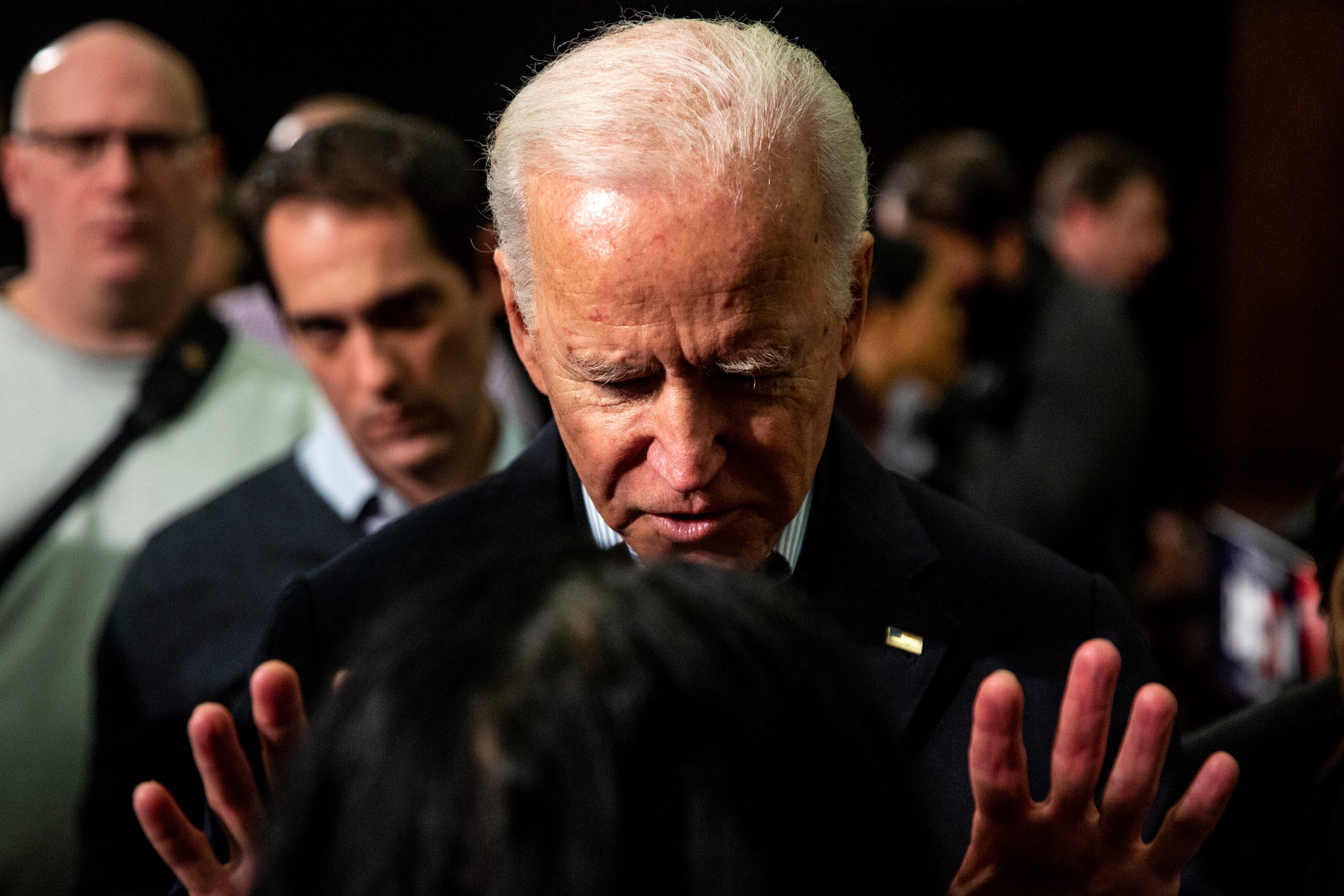 Former Vice President Joe Biden speaks to a woman in the crowd after giving a speech in the South Ballroom inside the Iowa State University Memorial Union on Wednesday, Dec. 4, 2019, in Ames. 