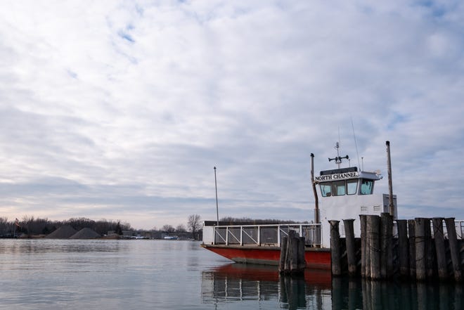 Champion's Auto Ferry is seen idle at the dock in Algonac Monday, Dec. 16, 2019, while crews work to repair the dock. The dock collapsed last Wednesday.
