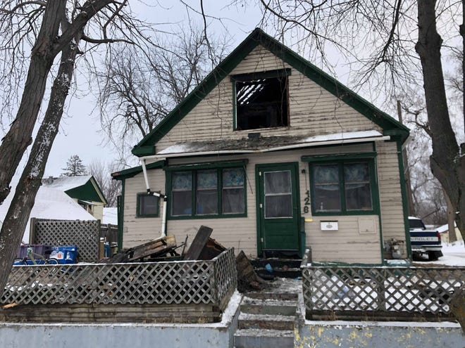 Sioux Falls Fire Rescue is investigating the cause of a fire that burned through the roof at 126 N. Grange Avenue.