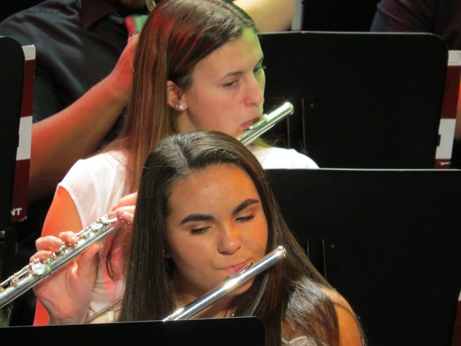 Sydney Sweeney of Cranford (above) and Kapriana Payami of Scotch Plains perform in the Upper School Winter Concert.