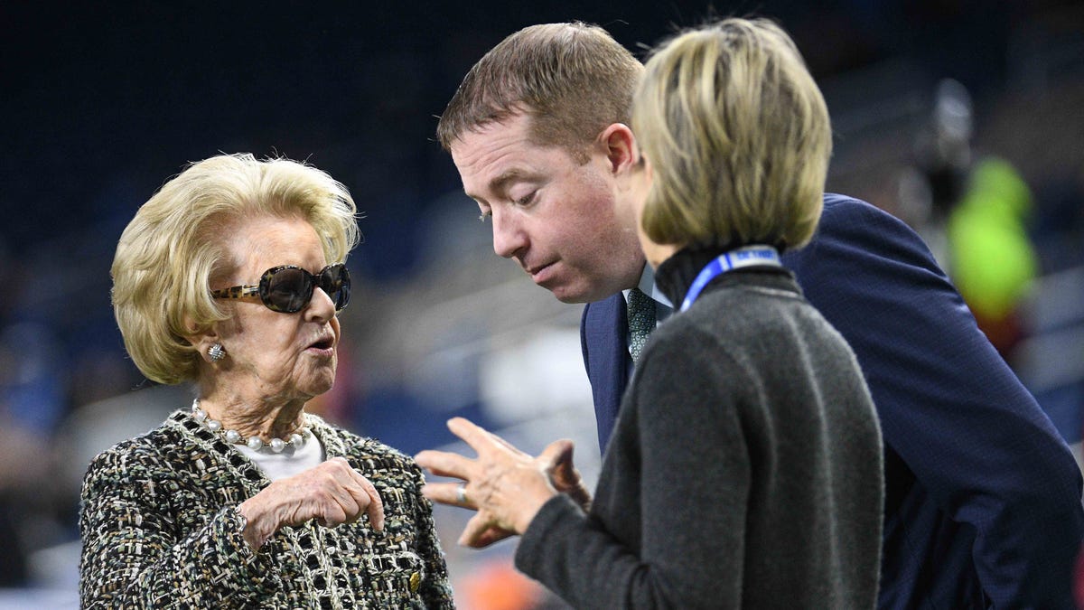 Detroit Lions owner Martha Ford talks to general manager Bob Quinn and vice chair Sheila Ford Hamp before the game against the Tampa Bay Buccaneers at Ford Field, Dec. 15, 2019.
