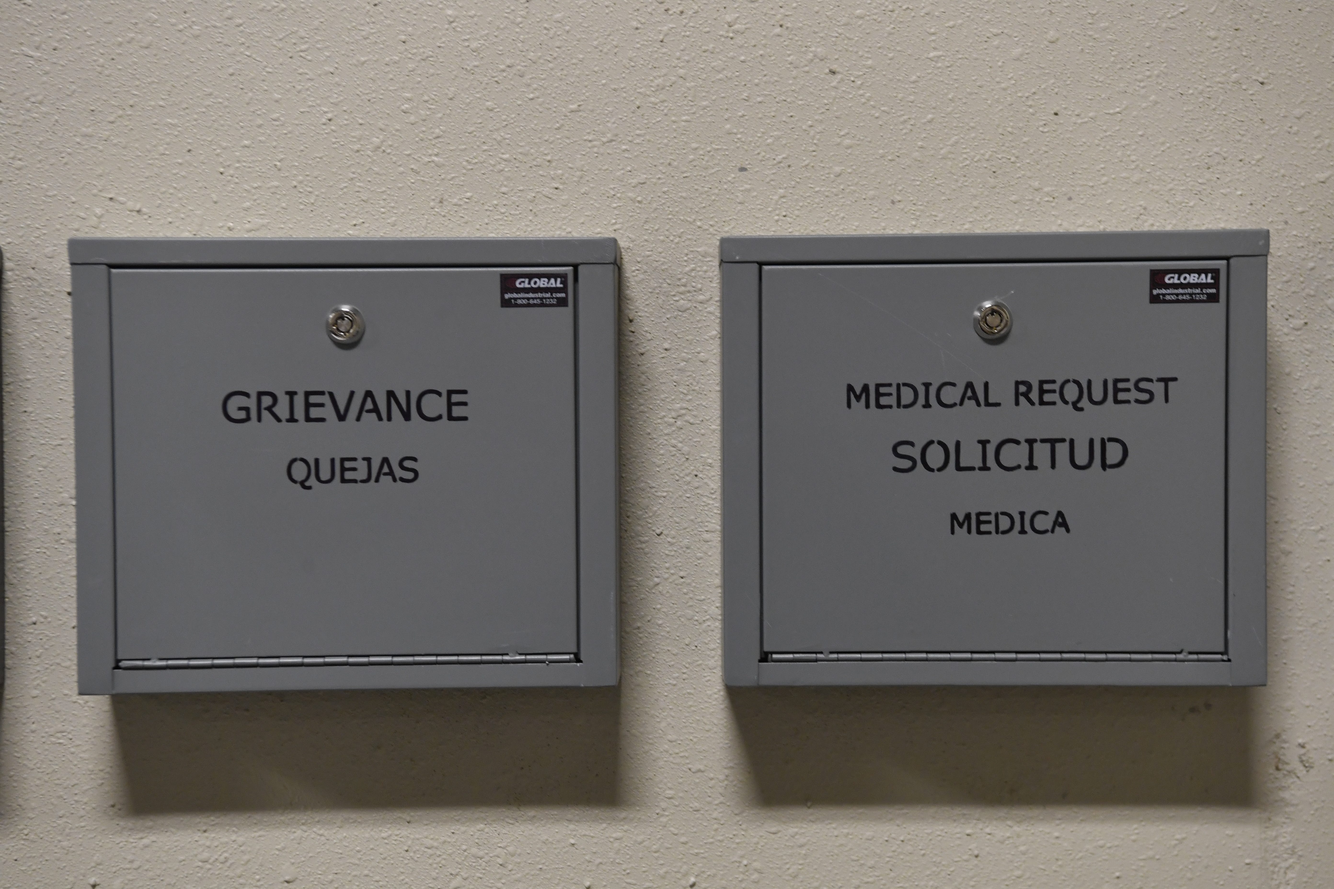 Grievance boxes are mounted in all of the living areas at the Bluebonnet Detention Center in Anson, Texas. Signs are written in both English and Spanish.