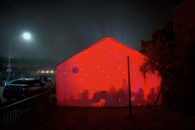 On the East Side of Salinas, families set up a party tent on the weekends. LED lights alternate colors and the sound of Banda music echos throughout the neighborhood.