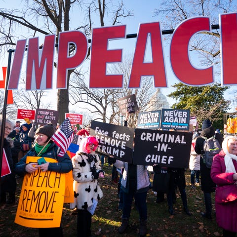 Activists gather at an 'Impeach and Remove' rally 