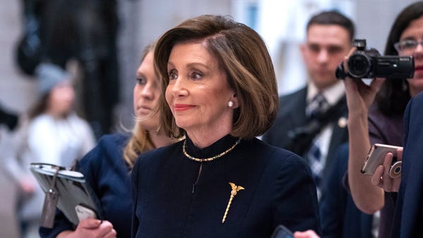 Democratic Speaker of the House Nancy Pelosi walks