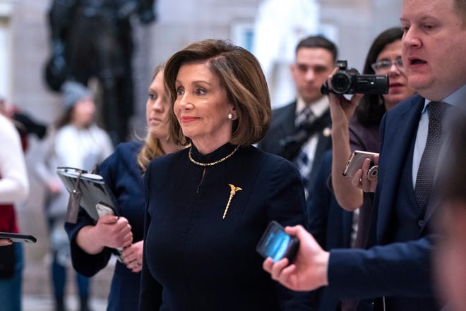 Speaker of the House Nancy Pelosi walks to the House floor to begin debate on votes to officially impeach President Donald Trump on two charges, abuse of power and obstruction of Congress, on Wednesday, December 18, 2019.
