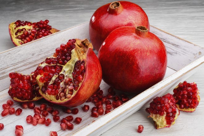 Pomegranate seeds are symbols of abundance. It is a Greek New Year's custom to break seeds on the door's threshold for good luck.