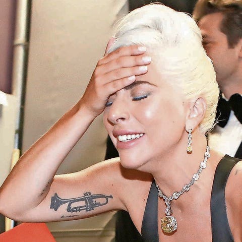 An emotional Lady Gaga clutches her Oscar for best