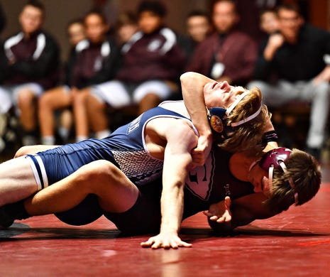 Dallastown's Sam Druck, top, and Gettysburg's Jarod Townsend wrestle in the 145 pound weight class during wrestling action at Gettysburg Area High School in Gettysburg, Wednesday, Dec. 18, 2019. Dawn J. Sagert photo