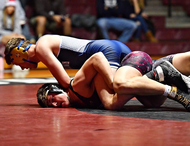 Dallastown's Blake Feeney, top, and Gettysburg's Max Gourley wrestle in the 182-pound weight class last December. Under a reduction in weight classes approved by the PIAA on Wednesday, the 182-pound class has essentially been eliminated.