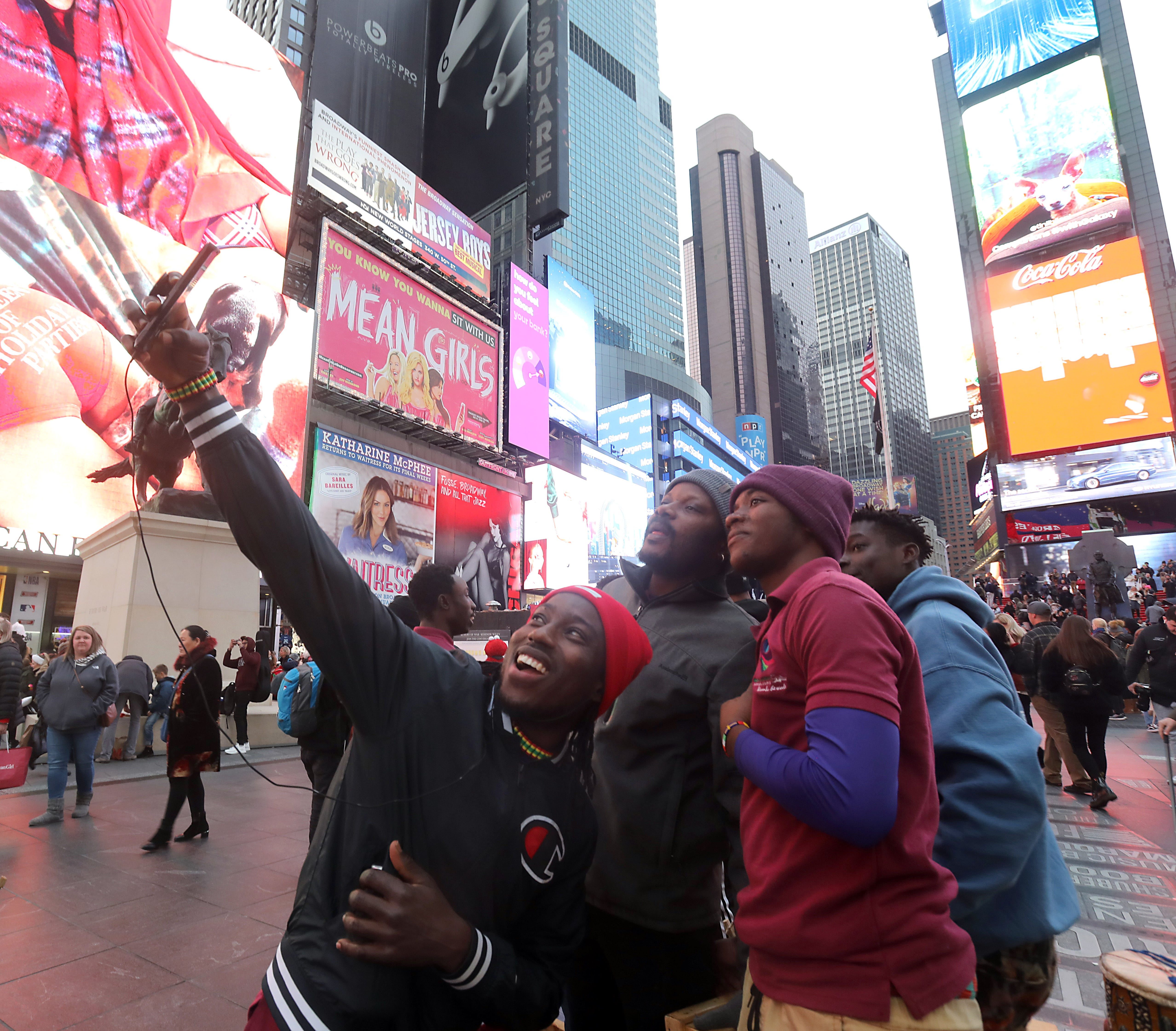 From left to right, Love Borketey, Stephen Nanakojo Osare, Julian Bortey Kwandahor and Samuel Afotey Odai take a selfie in Times Square.