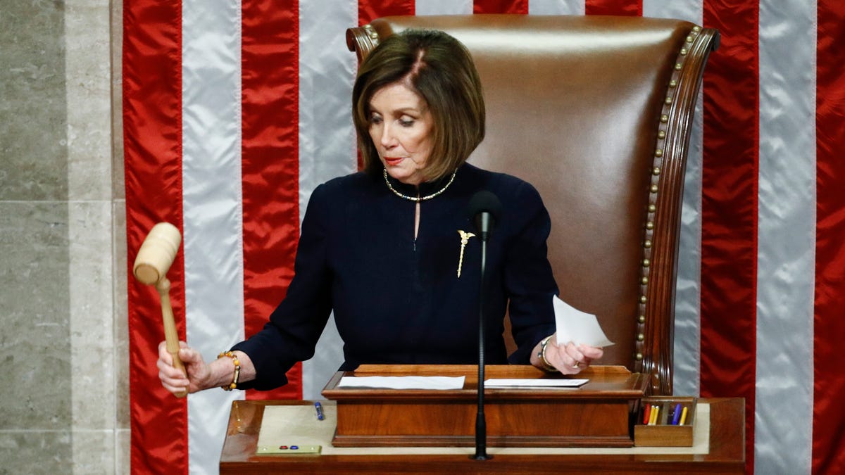Speaker of the House Nancy Pelosi strikes the gavel after announcing the passage of article II of impeachment against President Donald Trump, Dec. 18, 2019, on Capitol Hill in Washington.