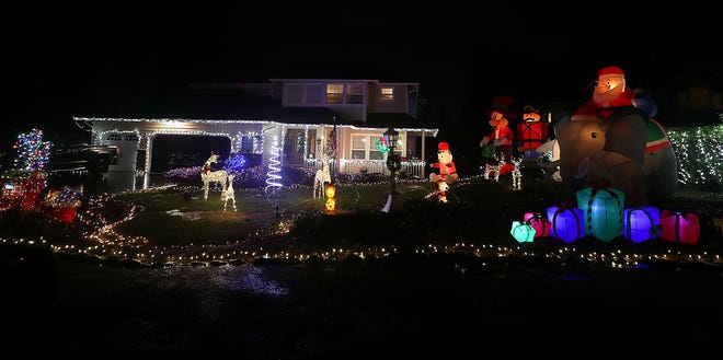 A home on Sirocco Circle in Silverdale lights up the night with holiday spirit.
