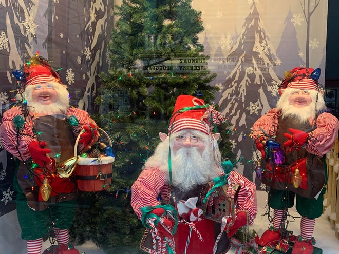 The Shillito's Elves in the windows of Sim's Furniture in downtown Covington.