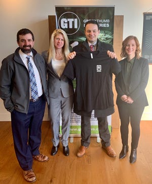 Attendees at ribbon-cutting for medical marijuana dispensary opening in Paterson on Friday, Dec. 20, 2019. From Left: Assistant NJ health commissioner Jeff Brown, Green Thumb CEO Devra Karlebach, Mayor Andre Sayegh, and Green Thumb’s Dina Rollman.