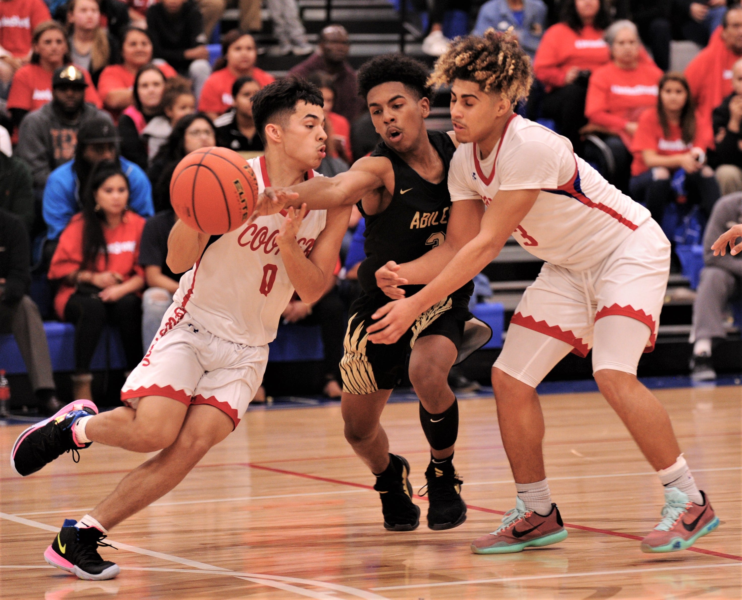 Abilene Cooper boys knock off Abilene High in overtime thriller