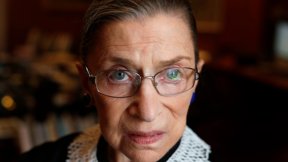 Associate Justice Ruth Bader Ginsburg poses for a photo in her chambers at the Supreme Court in Washington on July 24, 2013. Associate Justice Ginsburg assumed office on August 10, 1993, after being nominated by former US President Bill Clinton. Here's her life and career in pictures.