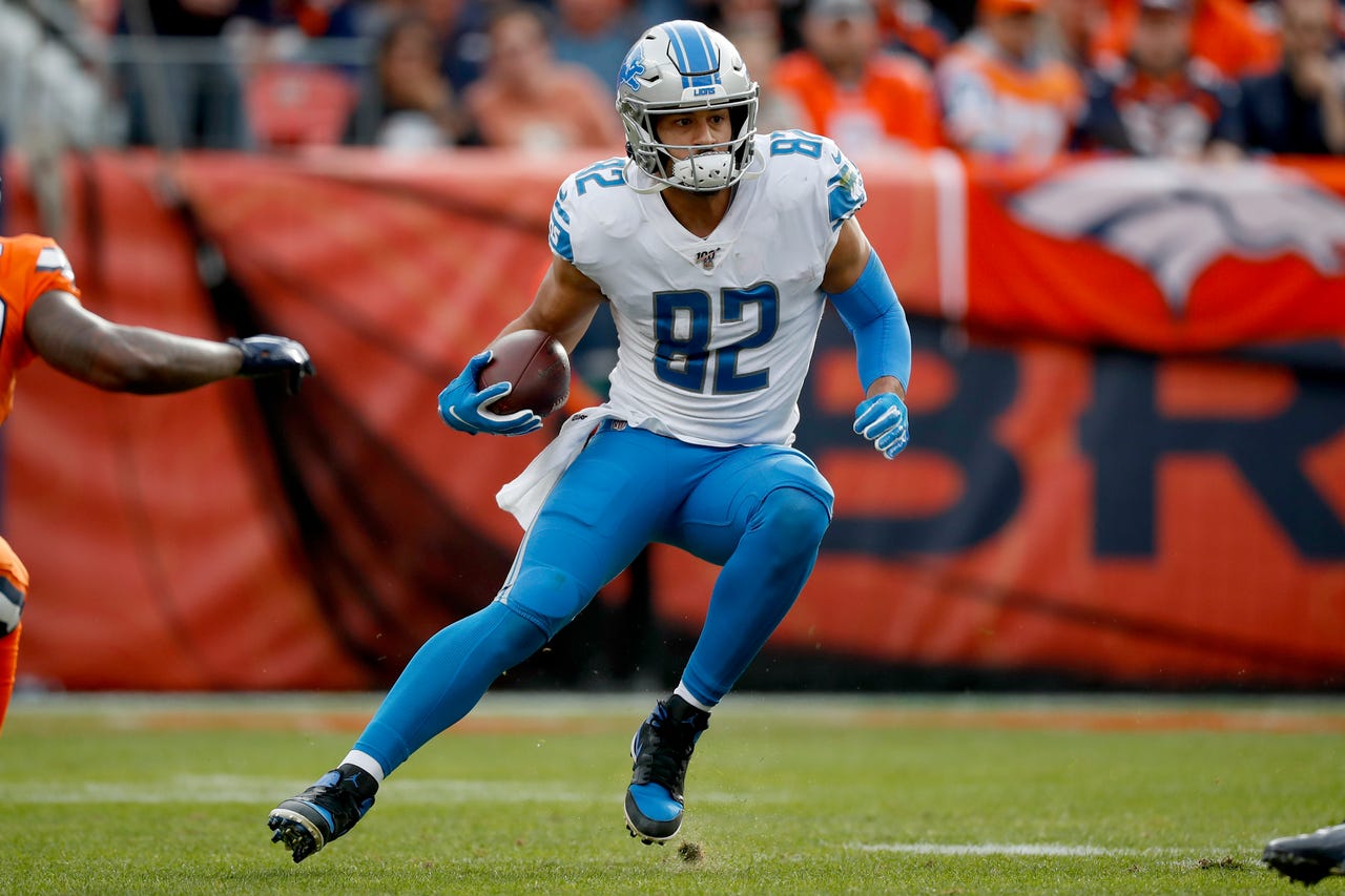 Lions tight end Logan Thomas runs a play against the Broncos during the first half on Sunday, Dec. 22, 2019, in Denver.