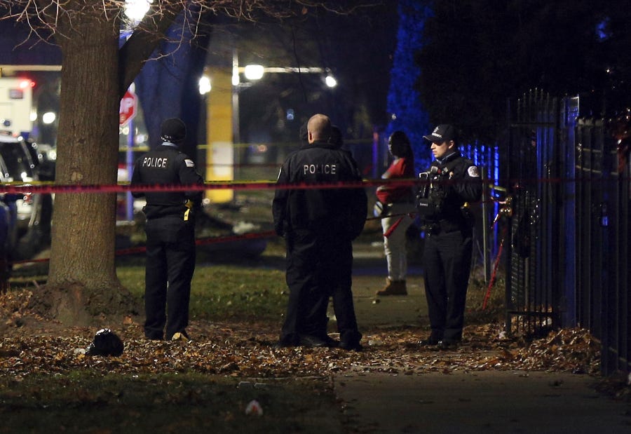 Chicago police guard a crime scene in the 5700 block of S. May Street in Chicago after several people were shot there on Sunday, Dec. 22, 2019.