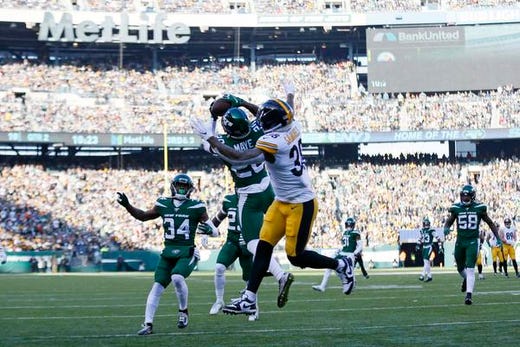 New York Jets free safety Marcus Maye (20) intercepts the ball in front of Pittsburgh Steelers running back Jaylen Samuels (38) in the first half of an NFL football game, Sunday, Dec. 22, 2019, in East Rutherford, N.J. (AP Photo/Adam Hunger)