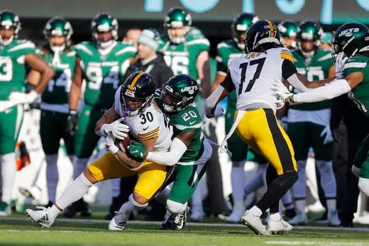Pittsburgh Steelers running back James Conner (30) is taken down by New York Jets free safety Marcus Maye (20) in the first half of an NFL football game, Sunday, Dec. 22, 2019, in East Rutherford, N.J. (AP Photo/Adam Hunger)