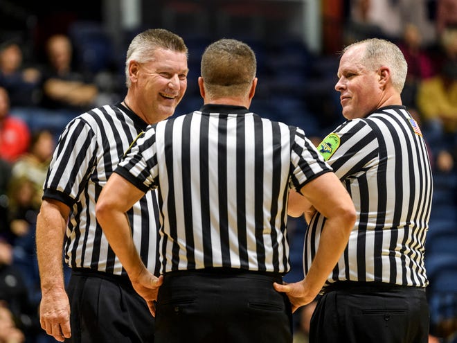 Veteran basketball officials do it for the love of the game