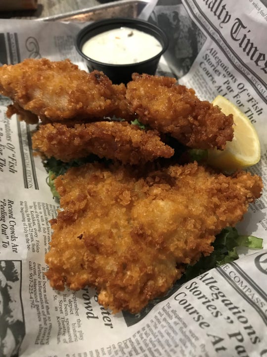 At The Sandbar in Fort Myers, visions of grouper fingers have JLB jolly