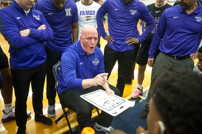 Male head basketball coach Tim Haworth talks to his players during a time-out in the semi-final game of the 39th annual King of the Bluegrass tournament.
Dec. 22, 2019