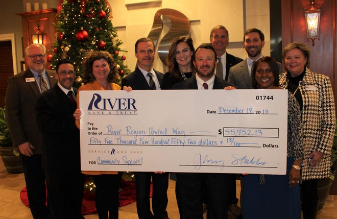 River Bank & Trust employees present a donation to the River Region United Way.