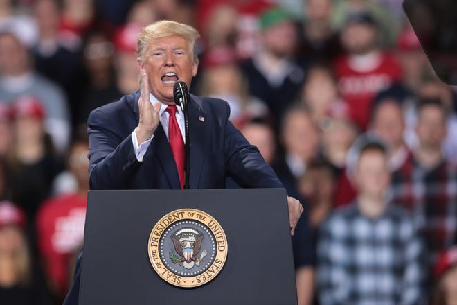 President Donald Trump addresses his impeachment during a "Merry Christmas" campaign rally at the Kellogg Arena in Battle Creek, Mich., on Wednesday, Dec. 18, 2019. (Scott Olson/Getty Images/TNS)