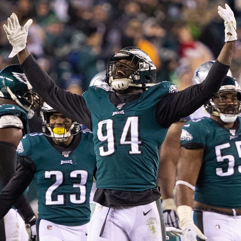 Eagles defensive end Josh Sweat reacts after sacki