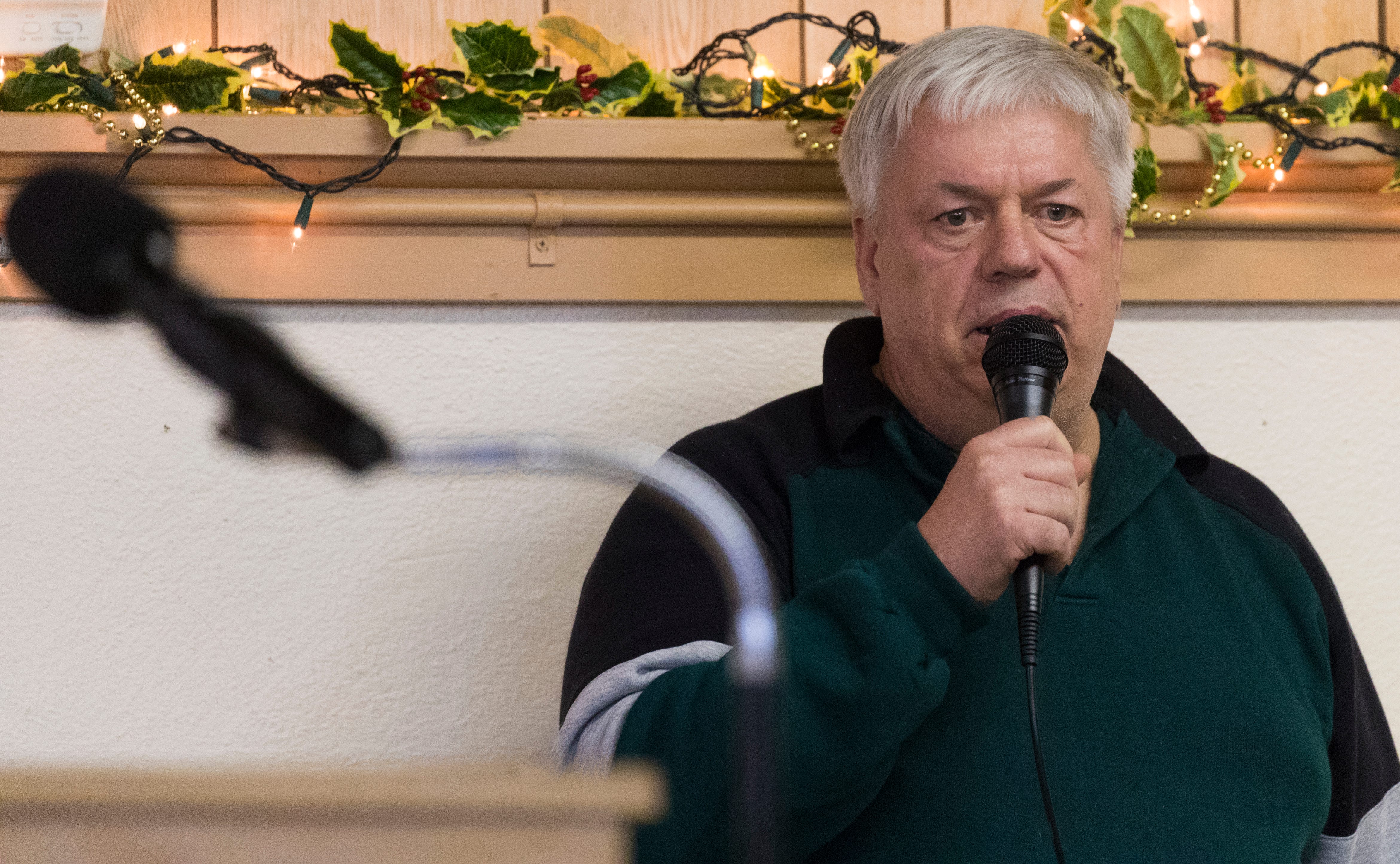 Former dairy farmer Steven Rynkowski sings "Take Heart My Friend" during a Farm Neighbors Care gathering at St. Peter's Lutheran Church in Loganville. He gave up dairy farming after battling depression, and the stress brought on by a farm expansion.