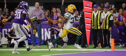 Green Bay Packers running back Aaron Jones (33) scores a touchdown on a12-yard run during the third quarter of their game Monday, December 23, 2019 at US Bank Stadium in Minneapolis, Minn. The Green Bay Packers beat the Minnesota Vikings 23-10.