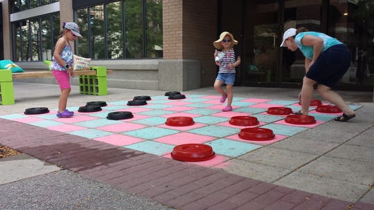Looking to get healthy in 2020? These food, exercise tips will help As part of the Building Active Communities Initiative, Get Fit volunteers transformed Davidson Plaza into a temporary active space which included a ping pong table, giant checkers, grass, plants and benches.