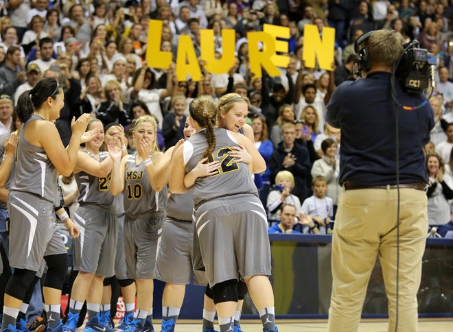 Lauren Hill, a freshman at Mount St. Joseph University who is battling an inoperable rare form of brain cancer, is introduced at the start of the game against Hiram College.  The game was being held at Xavier University's Cintas Center because of the large crowd.