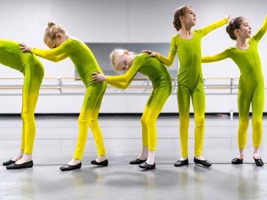 Little ballerinas learn how to become a caterpillar during rehearsal for their upcoming show Alice's Adventures in Wonderland at The School of Ballet Indiana in Evansville, Ind., Saturday, April 6, 2019. The ballerinas pictured are Emma Roemke, from left, Zoey Wildt, Selah Schmidt and Clara Gilbert. 