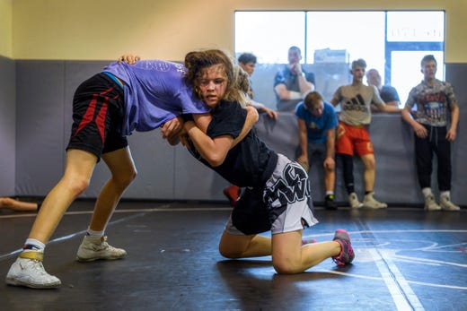 Kaylie Petersen, right, wrestles Reed Egli during a practice at Maurer Coughlin Wrestling Club in Evansville, Ind., Tuesday, April 23, 2019. She's been attending practices and receiving coaching at MCWC since 2014 and is often the only girl in the room. 