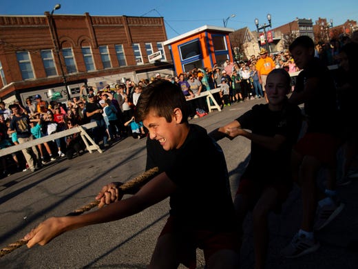 Kylian Wathen, 13, helps pull his St. Wendel team to a victory at the 98th West Side Nut Club Fall Festival Tuesday evening.