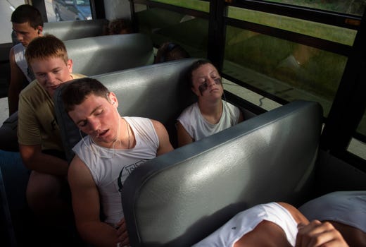 Senior Gavin Knust, left, and Abby Eckert, right, rest up on the way to an away game against the North Posey Vikings at North Posey High School in Poseyville, Ind., Friday, Sept. 27, 2019.