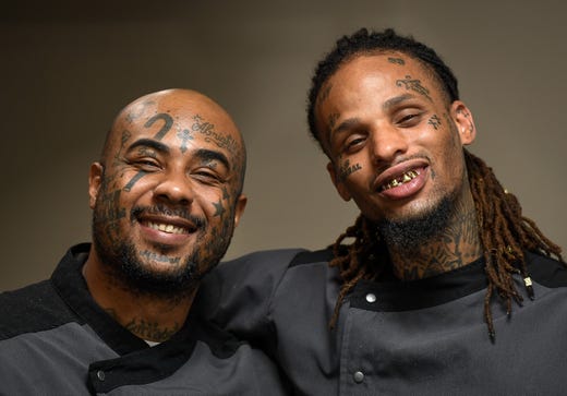 Working in the kitchen mentoring program at Gatrick’s, Ryan Hicks, left, and Darius Staten sport tattoos they received while incarcerated. Both said they got the tats as a form of artistic expression, now regret the decision and hope to someday have the facial tattoos removed Tuesday, June 11, 2019.