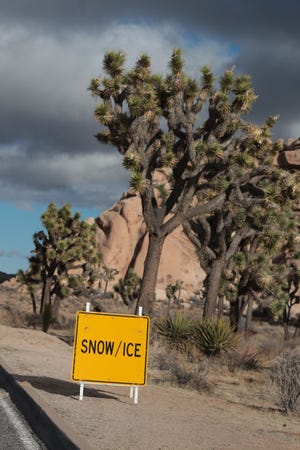People enjoy a cold but mostly sunny day at Joshua Tree National Park in Joshua Tree, Calif., on Wednesday, December 25, 2019. Parts of Joshua Tree National Park could see snow fall starting overnight. 