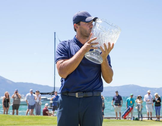 Tony Romo kisses the trophy after winning the ACC Golf Tournament at Edgewood Tahoe Golf Course in South Lake Tahoe on Sunday, July 14, 2019.