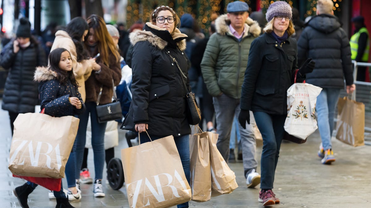 Shoppers walk down Oxford Street in London on Dec. 26.