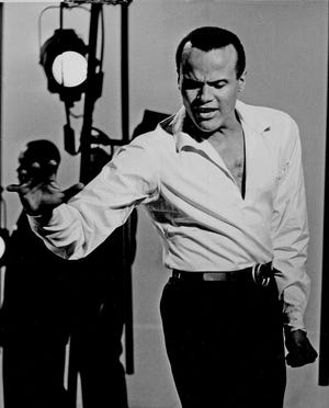 Harry Belafonte appears on the Broadway stage in "Belafonte At The Palace," Jan. 5, 1960, in New York.