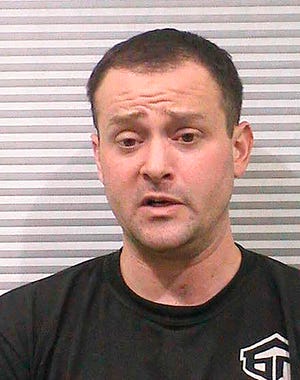 This undated booking photo provided by the Cache County Sheriff's Office shows Peter Ambrose, 34, of Smithfield, Utah. Authorities say Ambrose, vandalized a Church of Jesus Christ of Latter-day Saints temple because he was upset no women from the faith would date him and he has been charged with burglary and criminal mischief. (Cache County Sheriff's Office via AP)