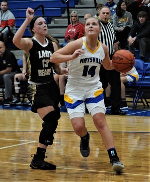 Maysville's Bailee Smith drives towards the bucket in Saturday's game. She scored a school-record 40 points in Maysville's 75-29 win.