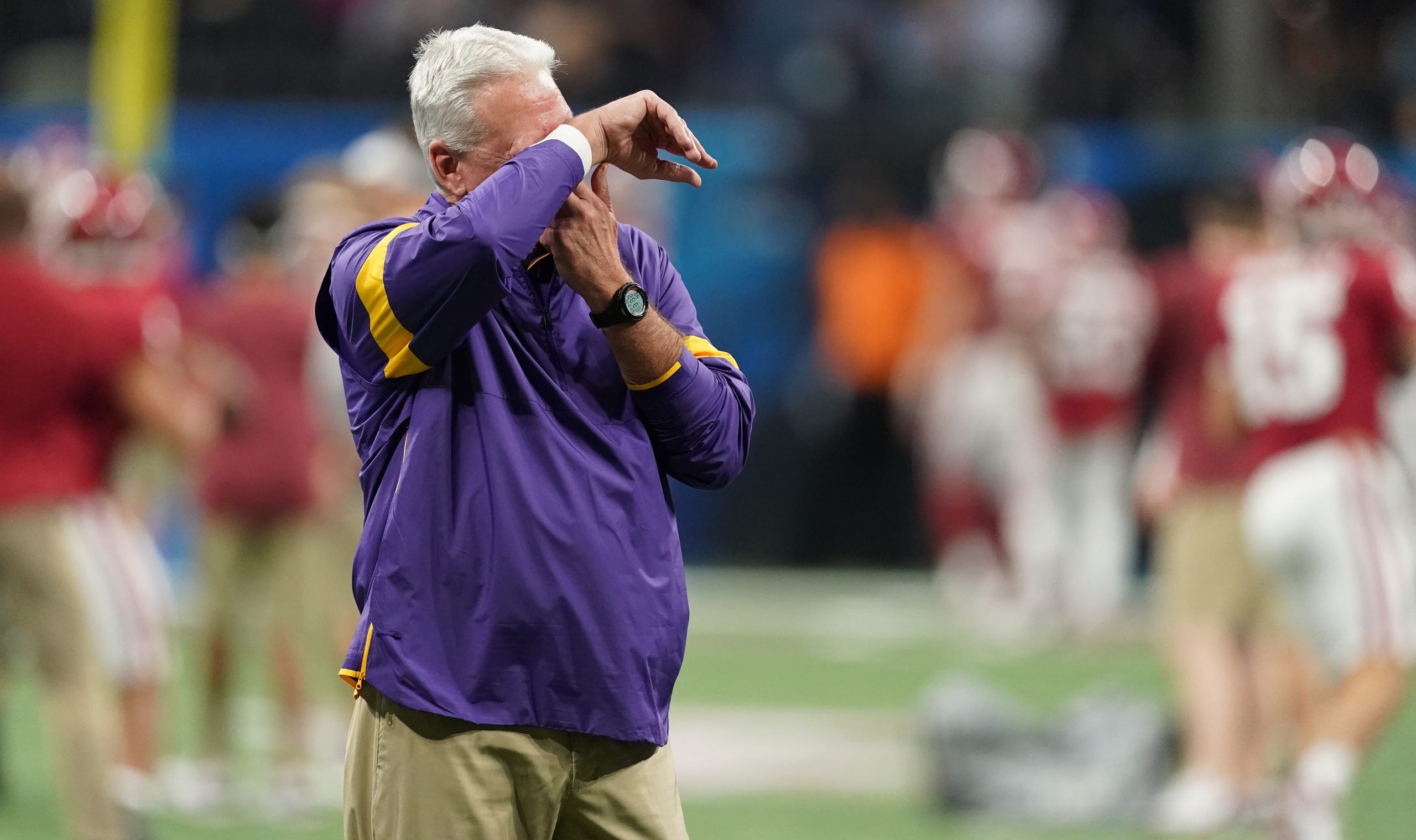 Dec 28, 2019; Atlanta, Georgia, USA; LSU Tigers offensive coordinator/quarterbacks coach Steve Ensminger reacts before the 2019 Peach Bowl college football playoff semifinal game against the Oklahoma Sooners. Mandatory Credit: John David Mercer-USA TODAY Sports