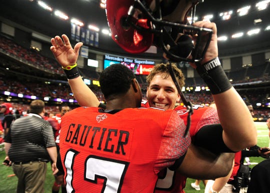 Kicker Brett Baer celebrates his game-winning field with quarterback Blaine Gautier after UL's 2011 New Orleans Bowl win over San Diego State.